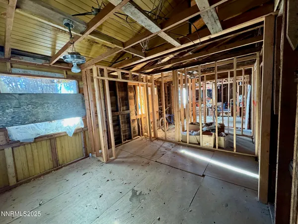 a view of an empty room with stairs