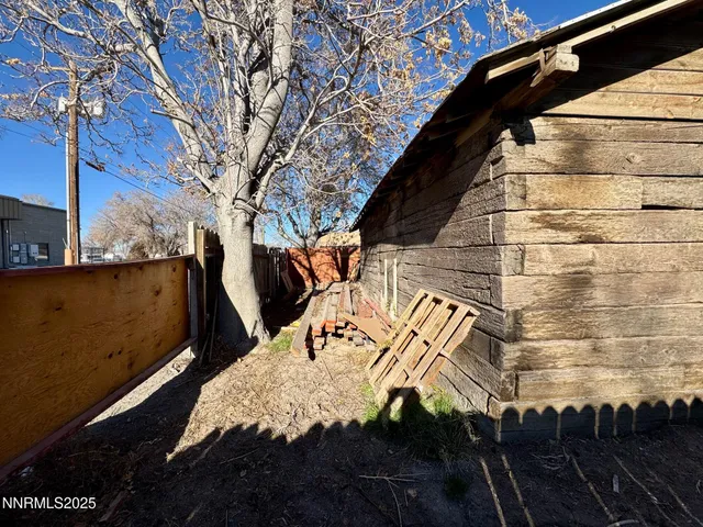 a view of a street with a building in the background