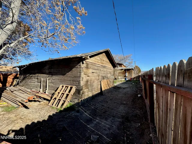 a view of a street in front of a house