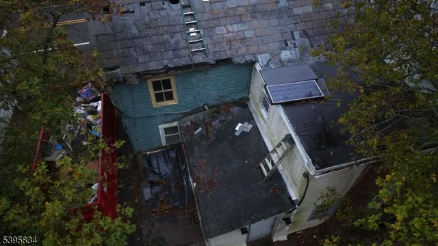 an aerial view of house with yard