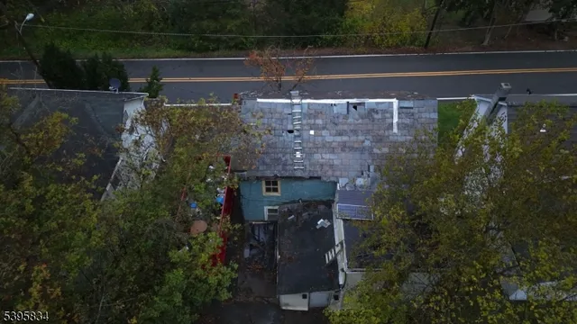 a view of a brick house with a yard