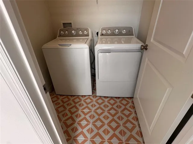 a view of utility room with dryer and washer