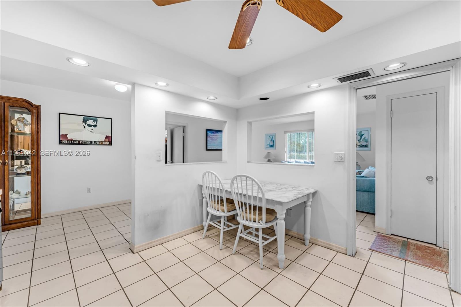 10901 Southwest 116th Street Miami, FL 33176 - Photo 11 of 26 a view of a livingroom with furniture and white cabinets