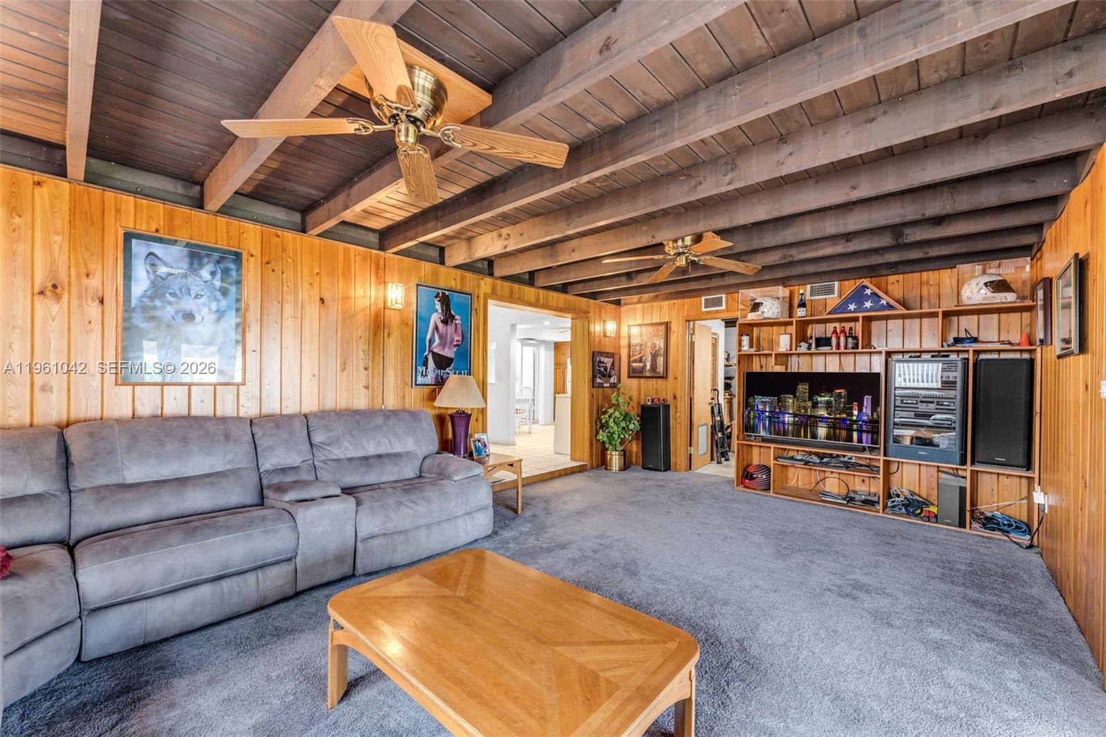 10901 Southwest 116th Street Miami, FL 33176 - Photo 13 of 26 a living room with lots of furniture and a large window