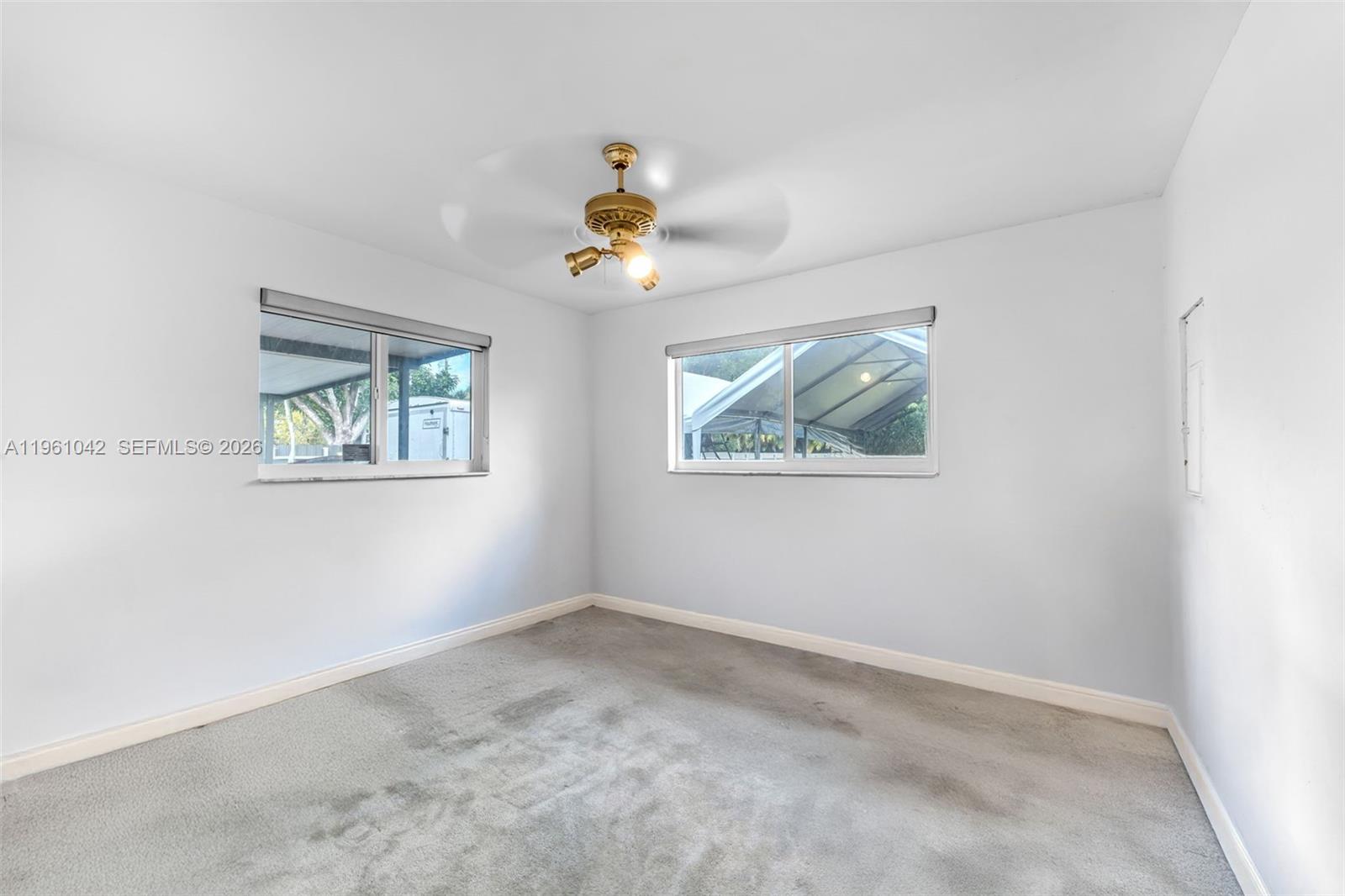 10901 Southwest 116th Street Miami, FL 33176 - Photo 18 of 26 a view of an empty room with a window