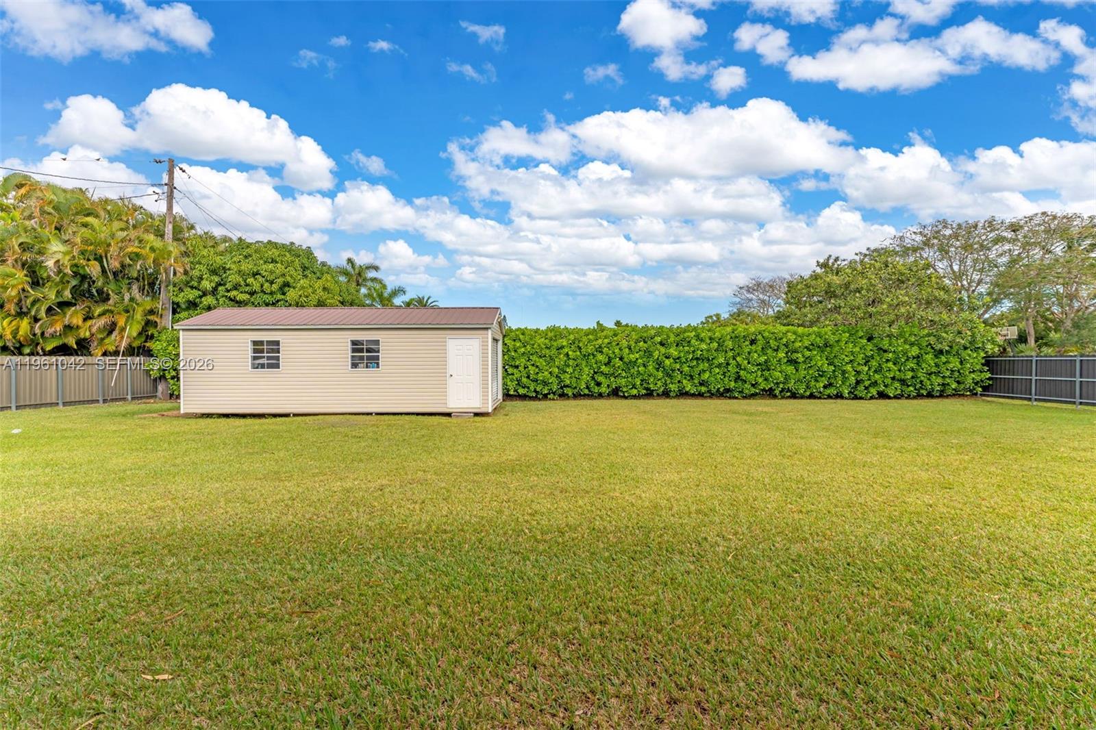 10901 Southwest 116th Street Miami, FL 33176 - Photo 19 of 26 a view of a house with a yard