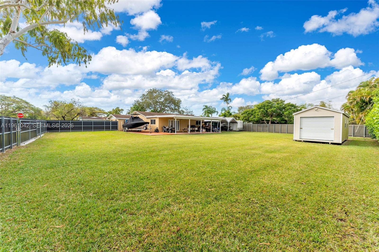 10901 Southwest 116th Street Miami, FL 33176 - Photo 20 of 26 a view of a lake with houses in the back