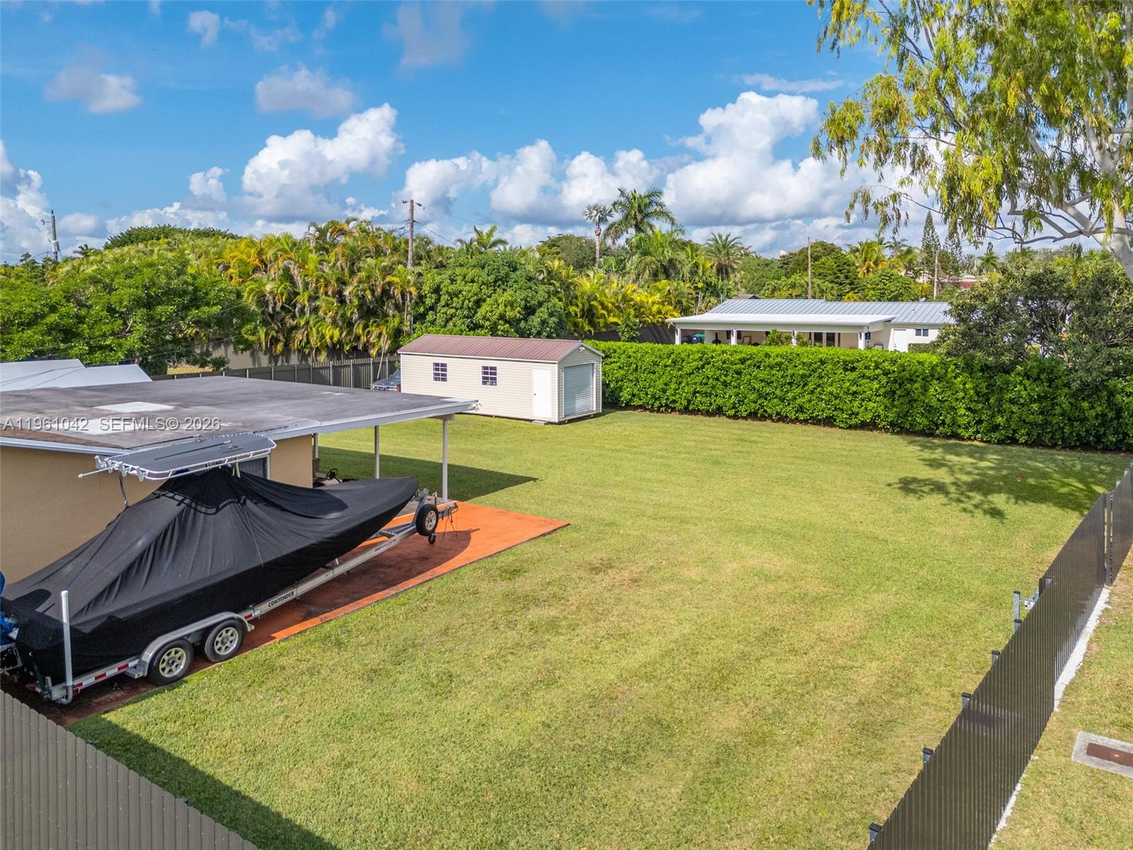 10901 Southwest 116th Street Miami, FL 33176 - Photo 21 of 26 a view of an outdoor space with swimming pool
