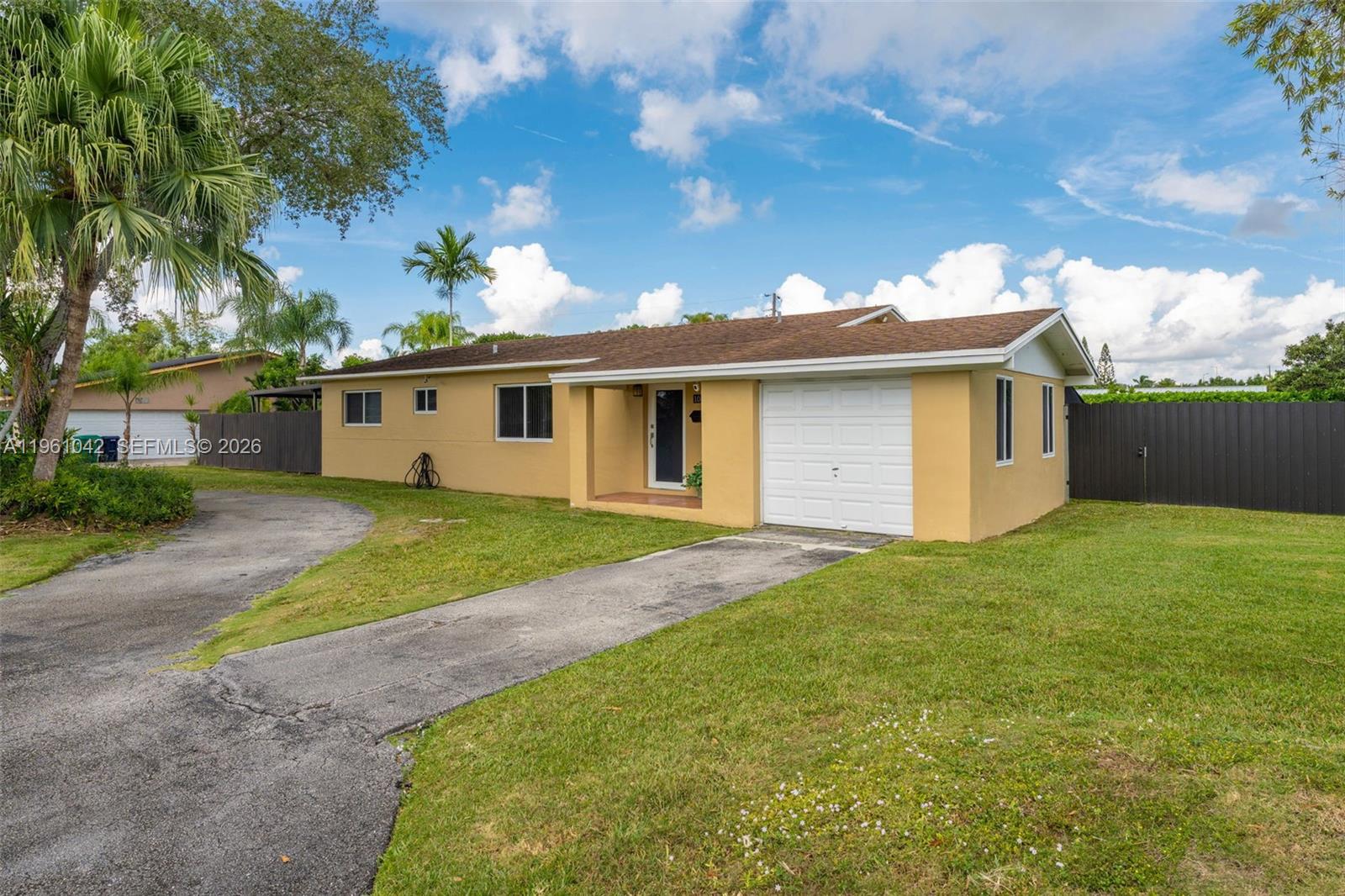 10901 Southwest 116th Street Miami, FL 33176 - Photo 5 of 26 a view of a house with a backyard