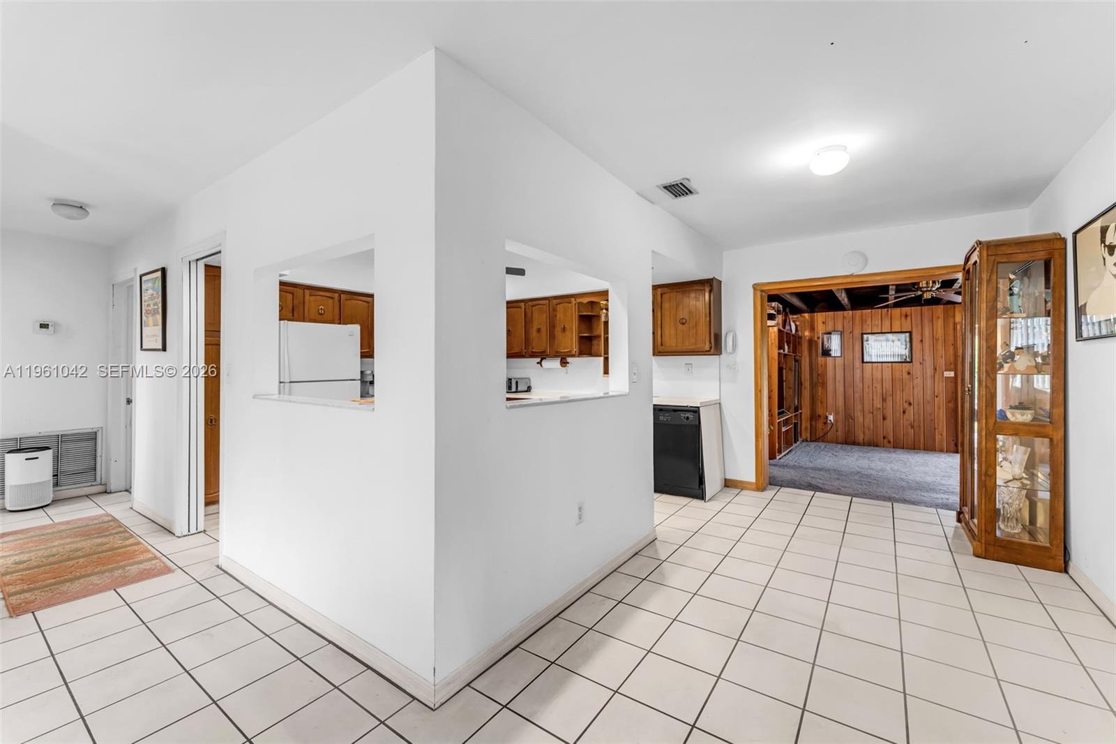 10901 Southwest 116th Street Miami, FL 33176 - Photo 8 of 26 a view of a hallway with wooden floor and windows