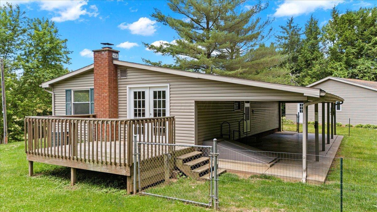 3011 Barth Road Belpre, OH 45714 - Photo 8 of 32 Side view, deck off kitchen, covered deck and storm door