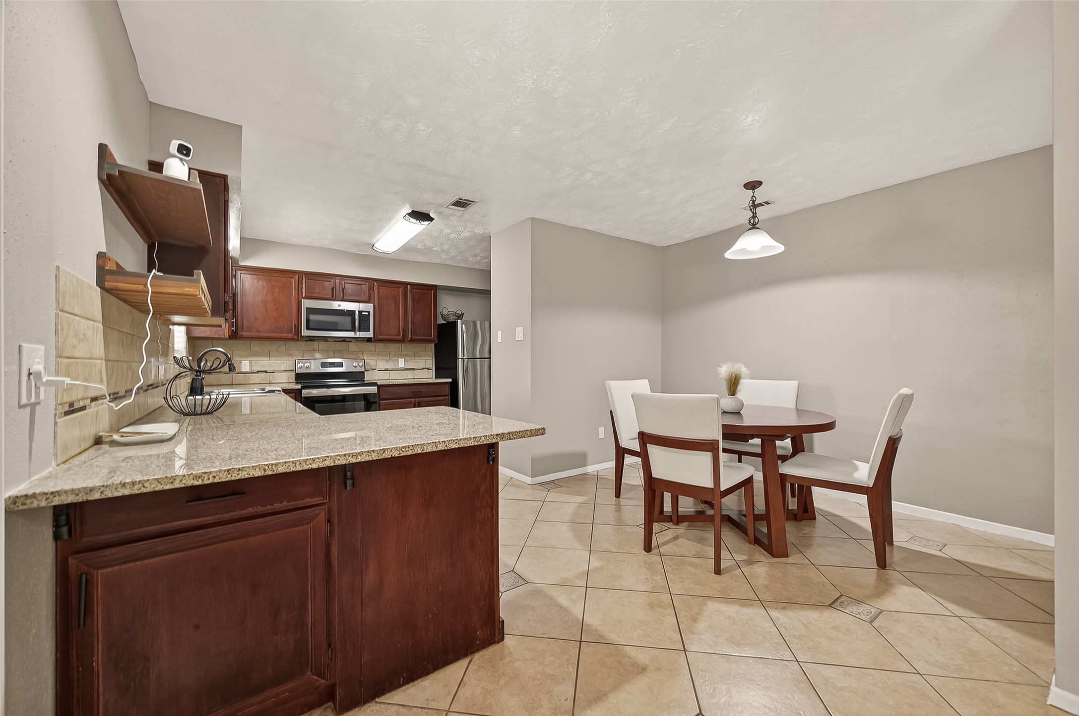 1407 Somercotes Lane Channelview, TX 77530 - Photo 12 of 28 a kitchen with a sink cabinets and wooden floor