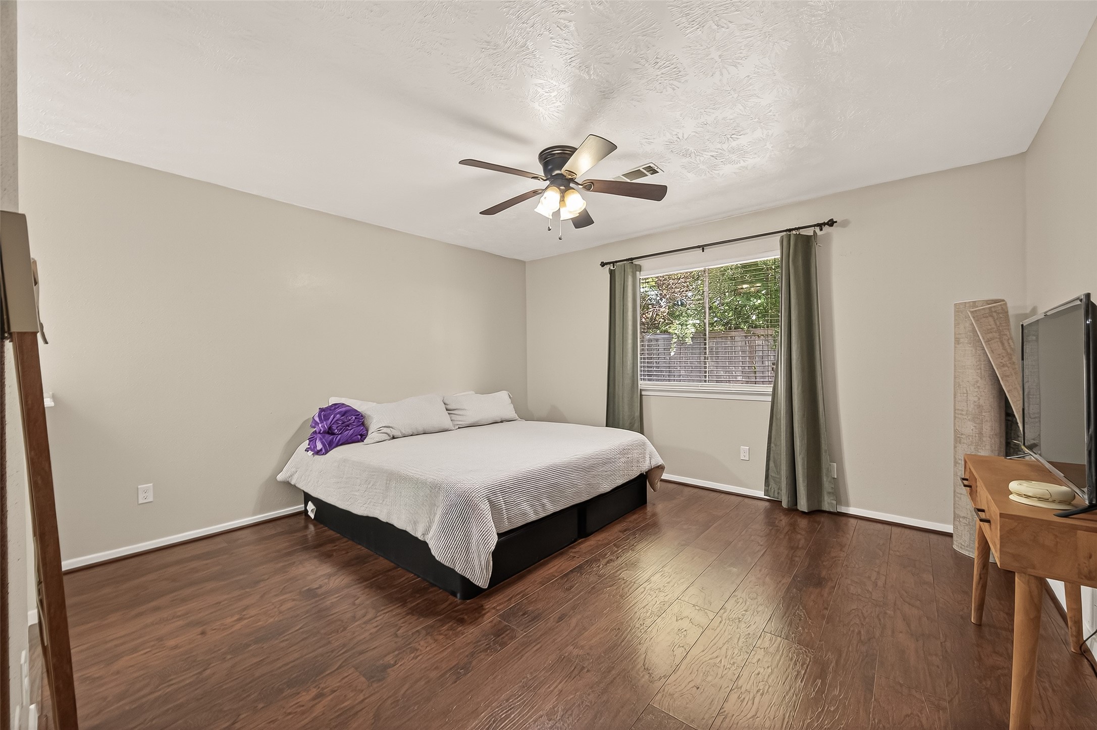 1407 Somercotes Lane Channelview, TX 77530 - Photo 15 of 28 a room with a bed and a chandelier
