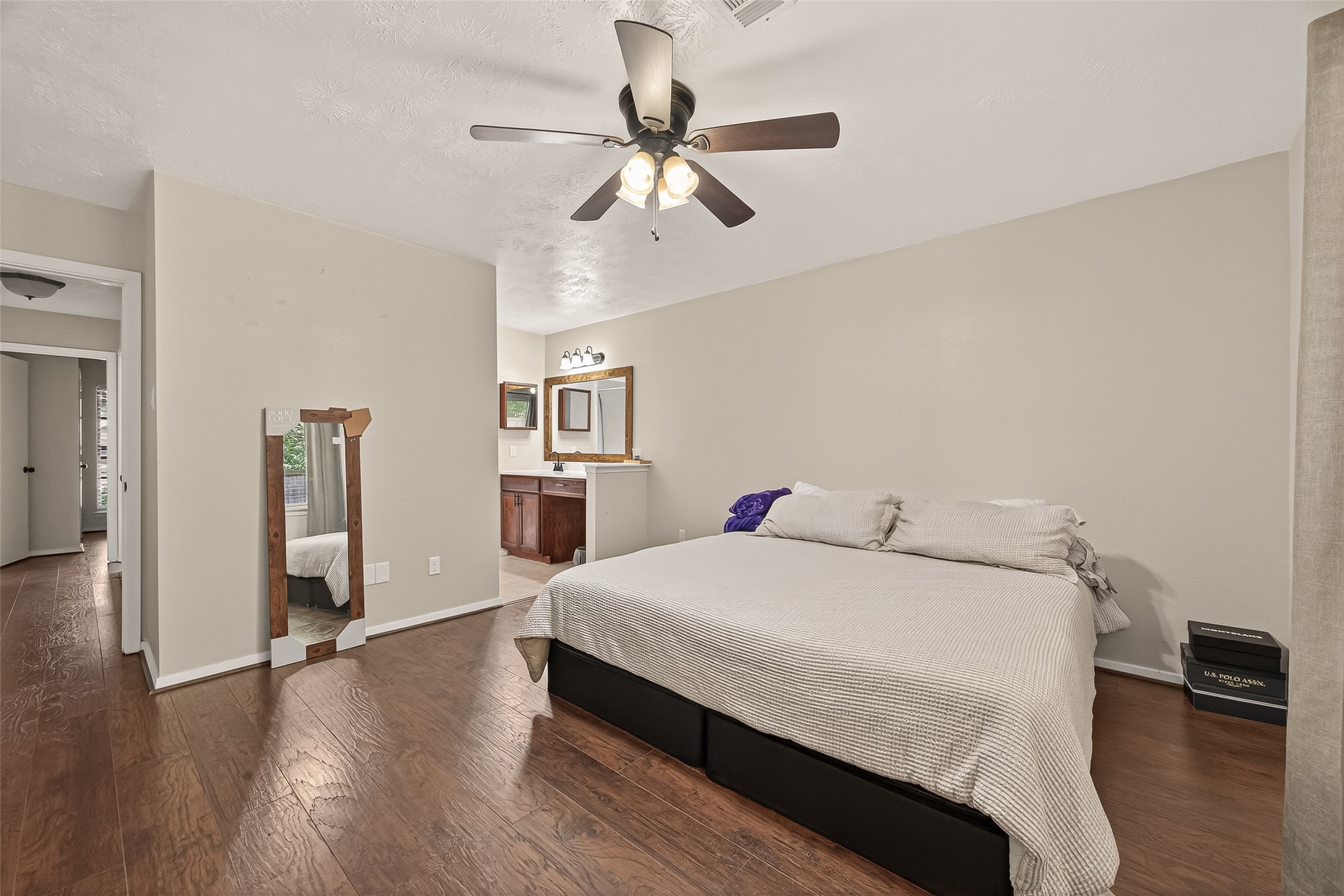 1407 Somercotes Lane Channelview, TX 77530 - Photo 16 of 28 a bedroom with a bed and wooden floor