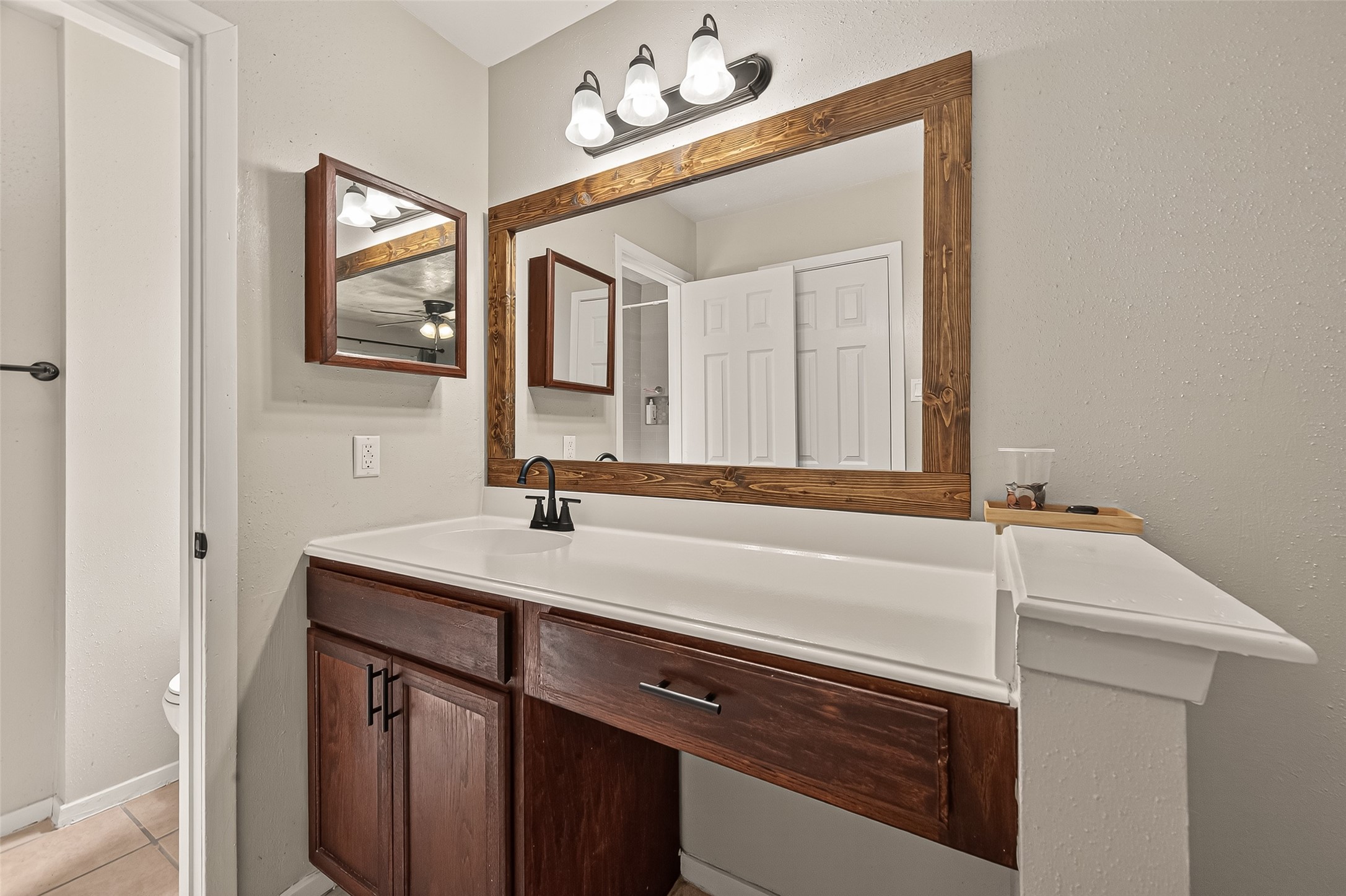 1407 Somercotes Lane Channelview, TX 77530 - Photo 19 of 28 a bathroom with a sink and a mirror