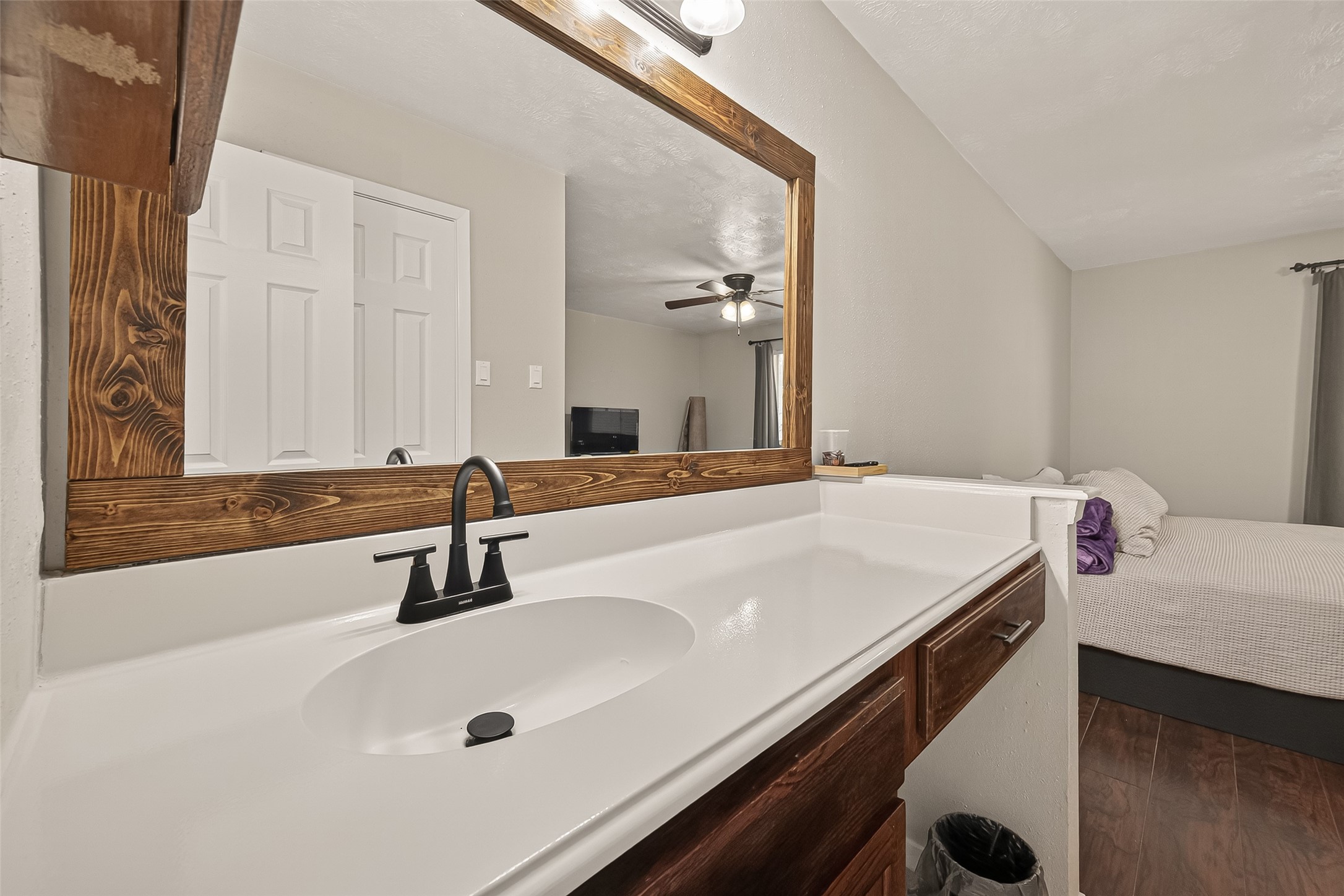 1407 Somercotes Lane Channelview, TX 77530 - Photo 20 of 28 a bathroom with a sink and a large mirror