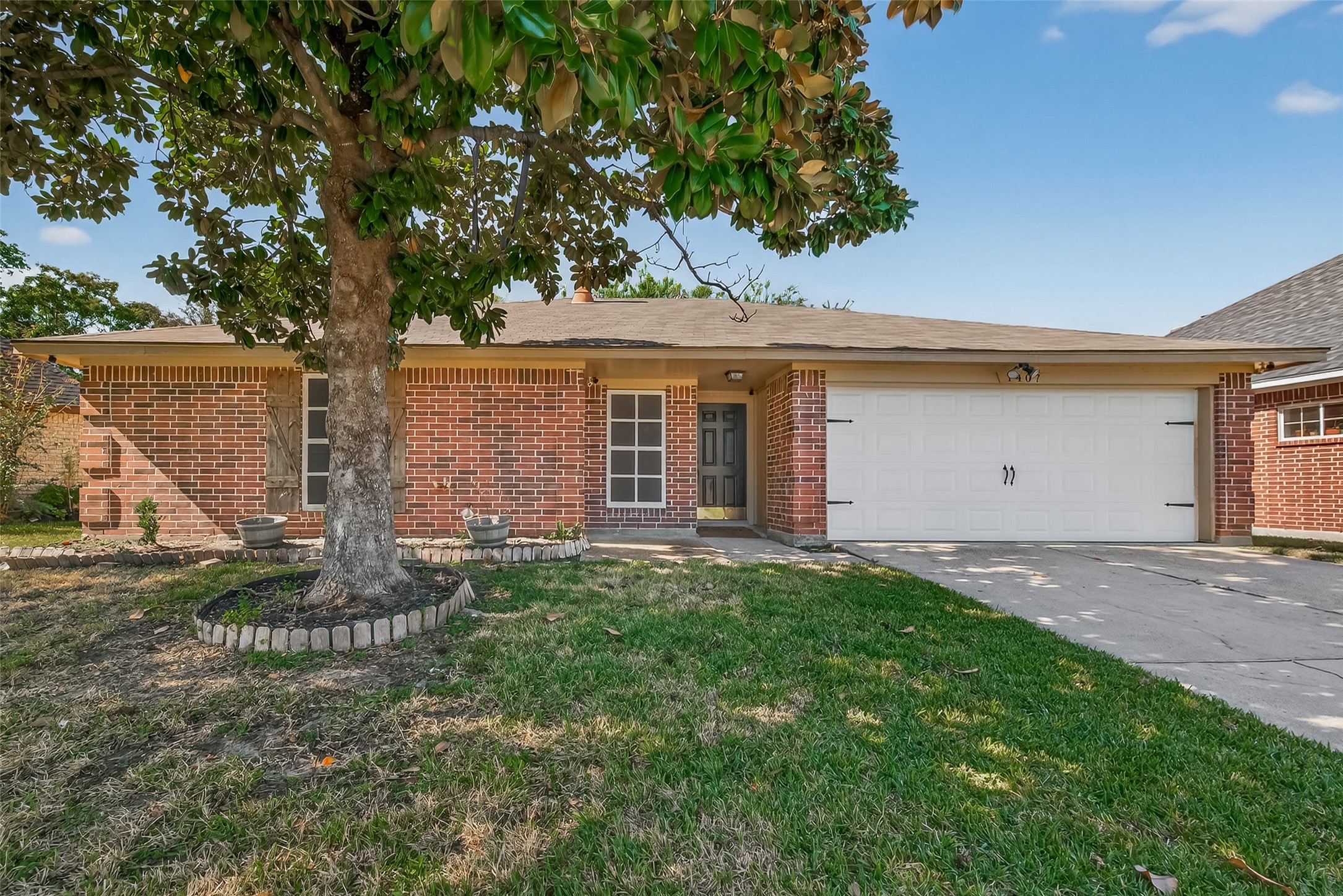 1407 Somercotes Lane Channelview, TX 77530 - Photo 2 of 28 a front view of a house with garden