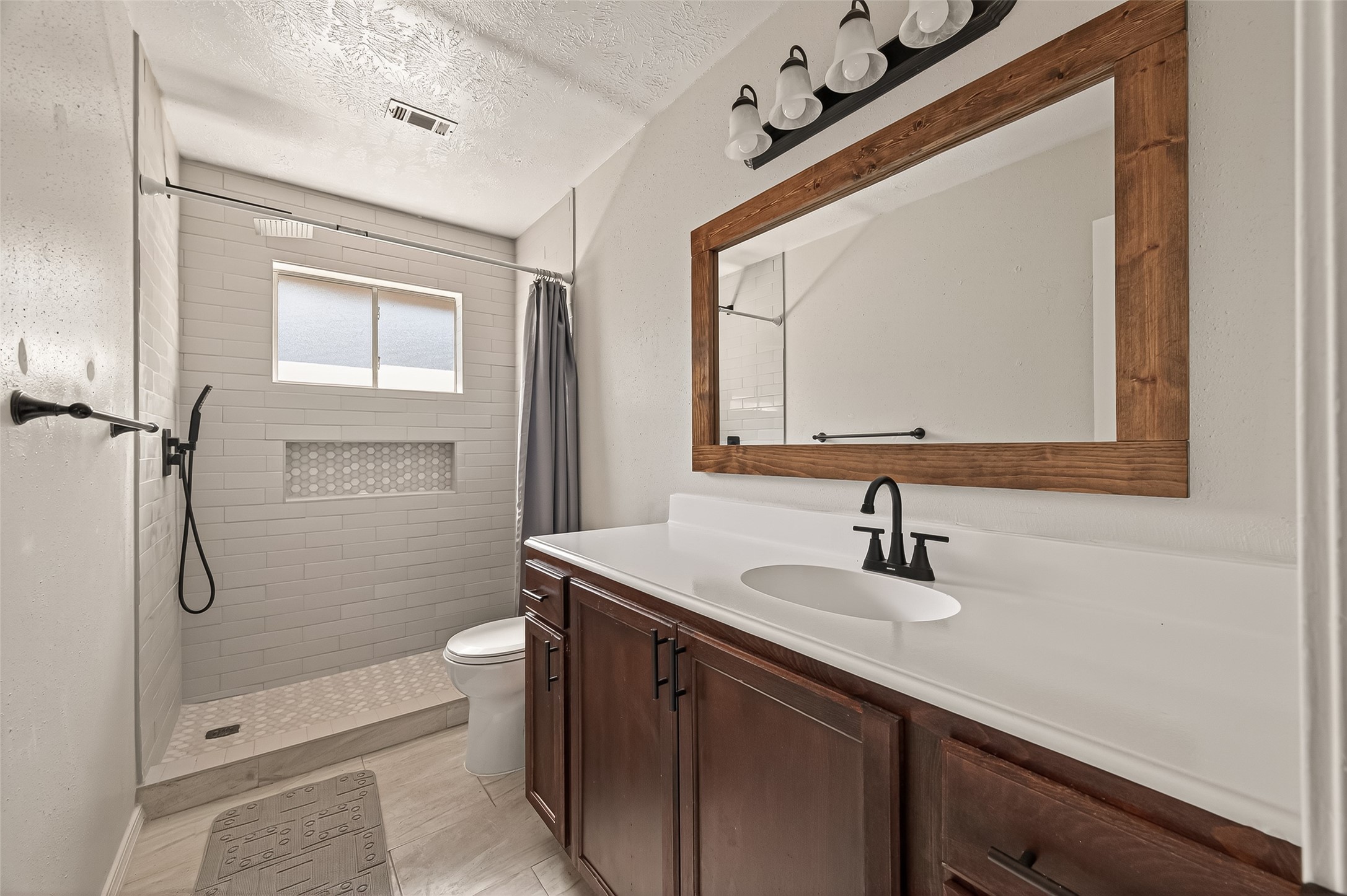 1407 Somercotes Lane Channelview, TX 77530 - Photo 22 of 28 a bathroom with a sink a toilet and shower