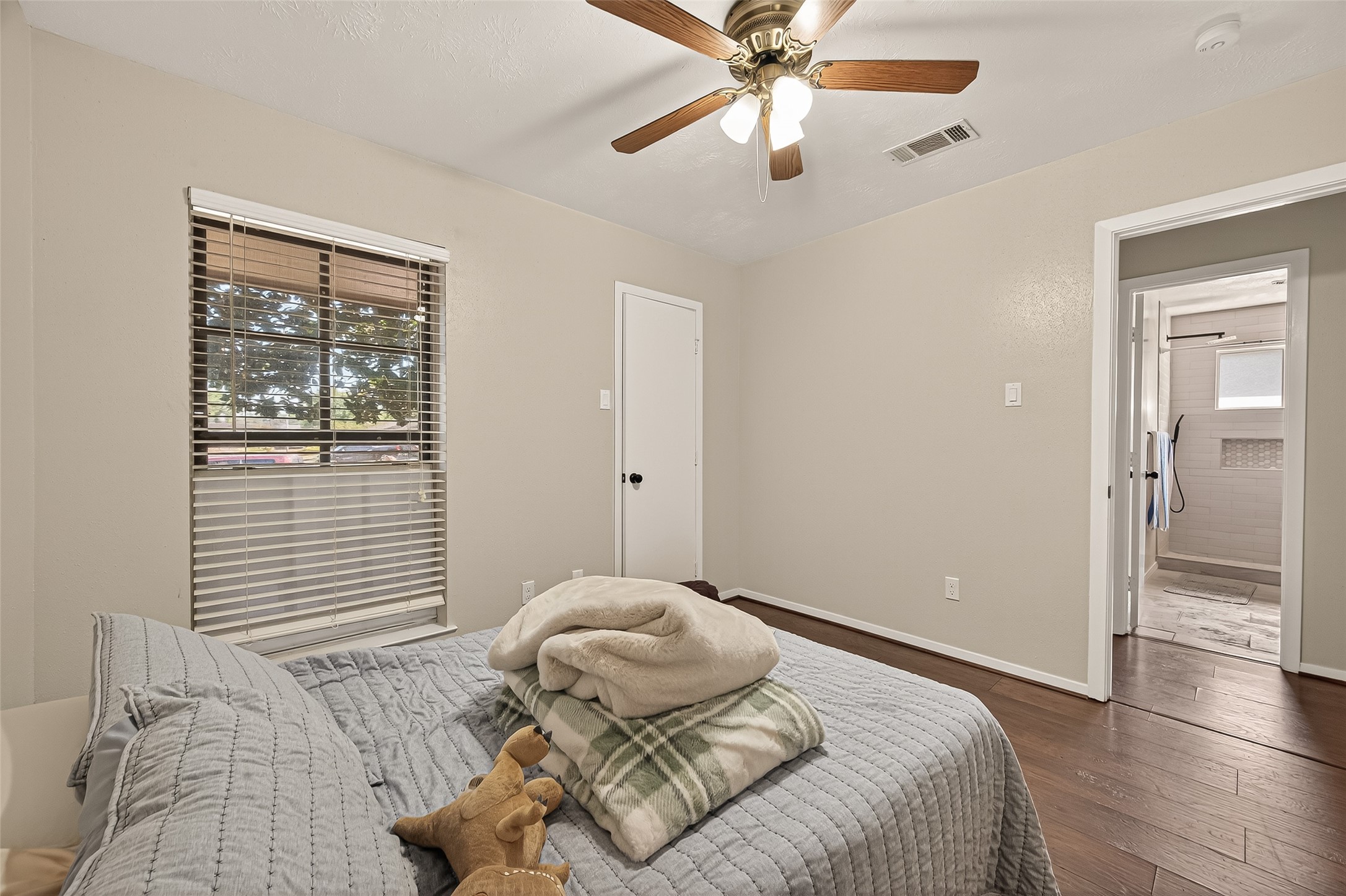 1407 Somercotes Lane Channelview, TX 77530 - Photo 23 of 28 a bedroom with a bed and wooden floor