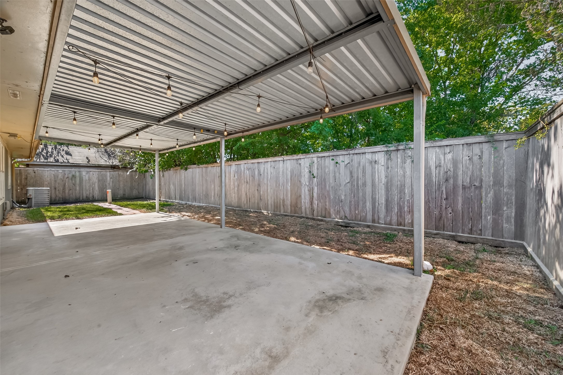 1407 Somercotes Lane Channelview, TX 77530 - Photo 28 of 28 a view of a backyard with wooden fence