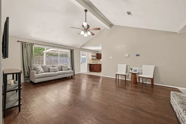 a view of a livingroom with furniture and a table chair
