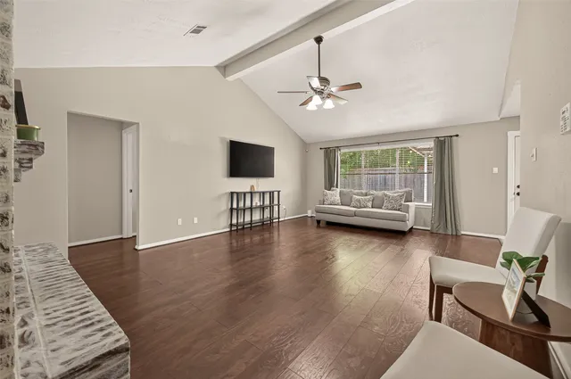 a view of livingroom with furniture wooden floor and windows