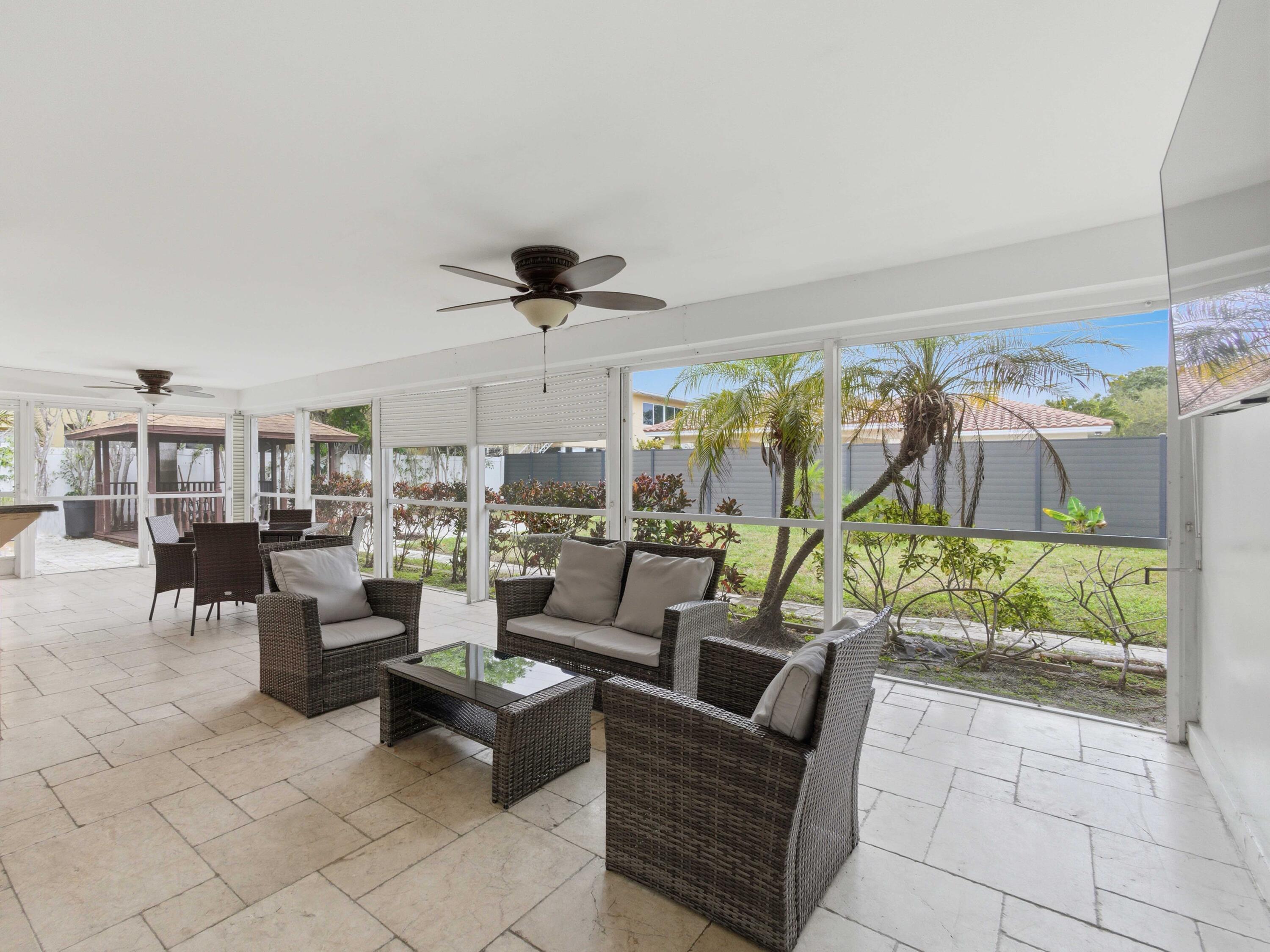 1921 Northeast 28th Court Lighthouse Point, FL 33064 - Photo 28 of 40 Screened Porch