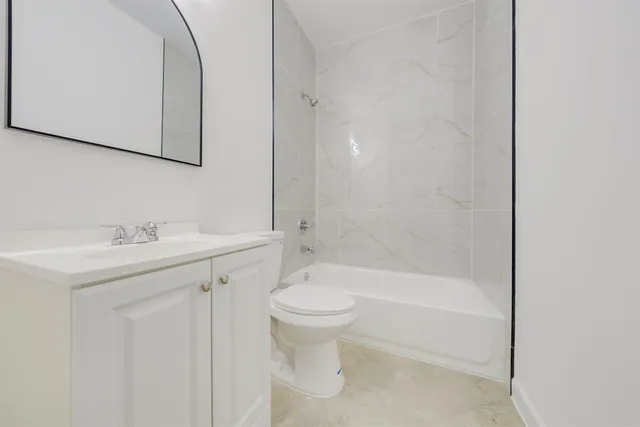 a bathroom with a sink a toilet and a bathtub