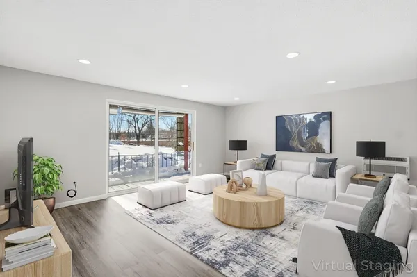 a living room with furniture and a large window