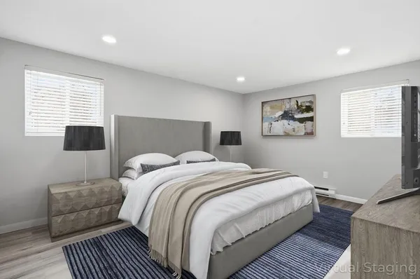 a bedroom with a bed and a couch