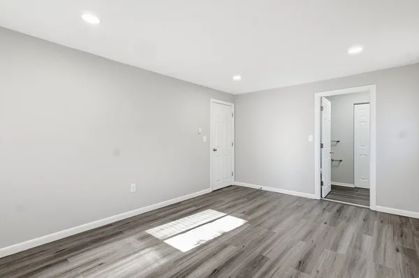 a view of wooden floor in an empty room