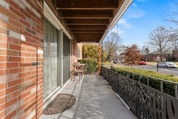 a view of a porch with wooden floor and outdoor space