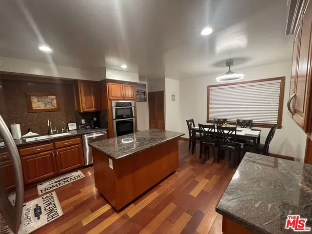 a large kitchen with lots of counter space and a sink