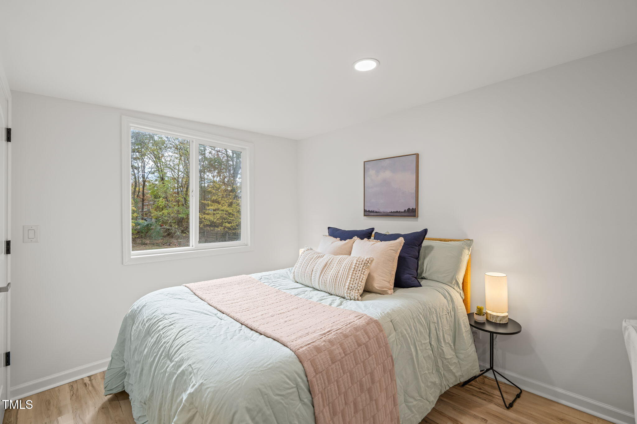 316 Ebon Road Durham, NC 27713 - Photo 18 of 48 a bedroom with a bed and a window