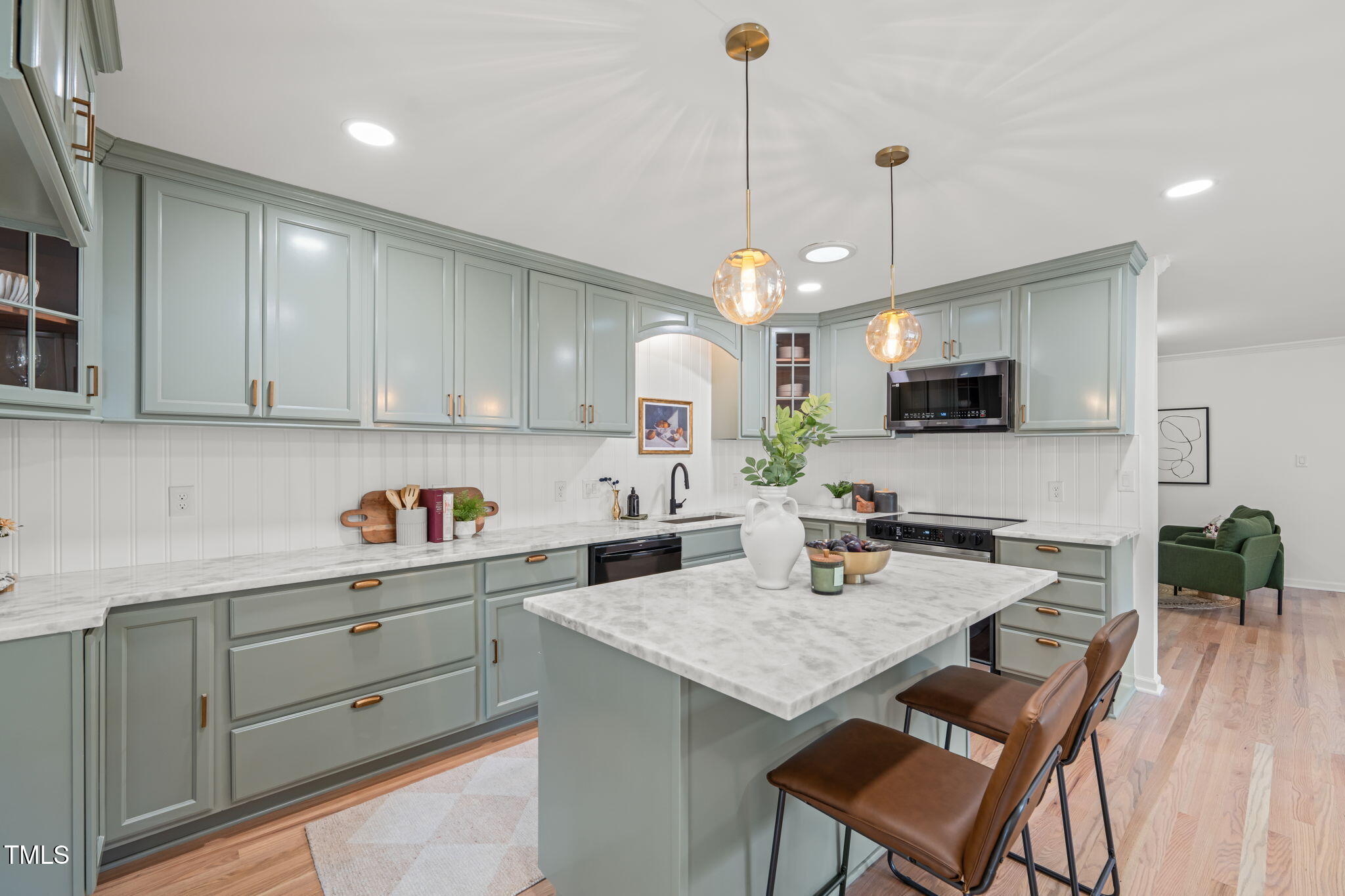 316 Ebon Road Durham, NC 27713 - Photo 3 of 48 a kitchen with granite countertop kitchen island cabinets and stainless steel appliances