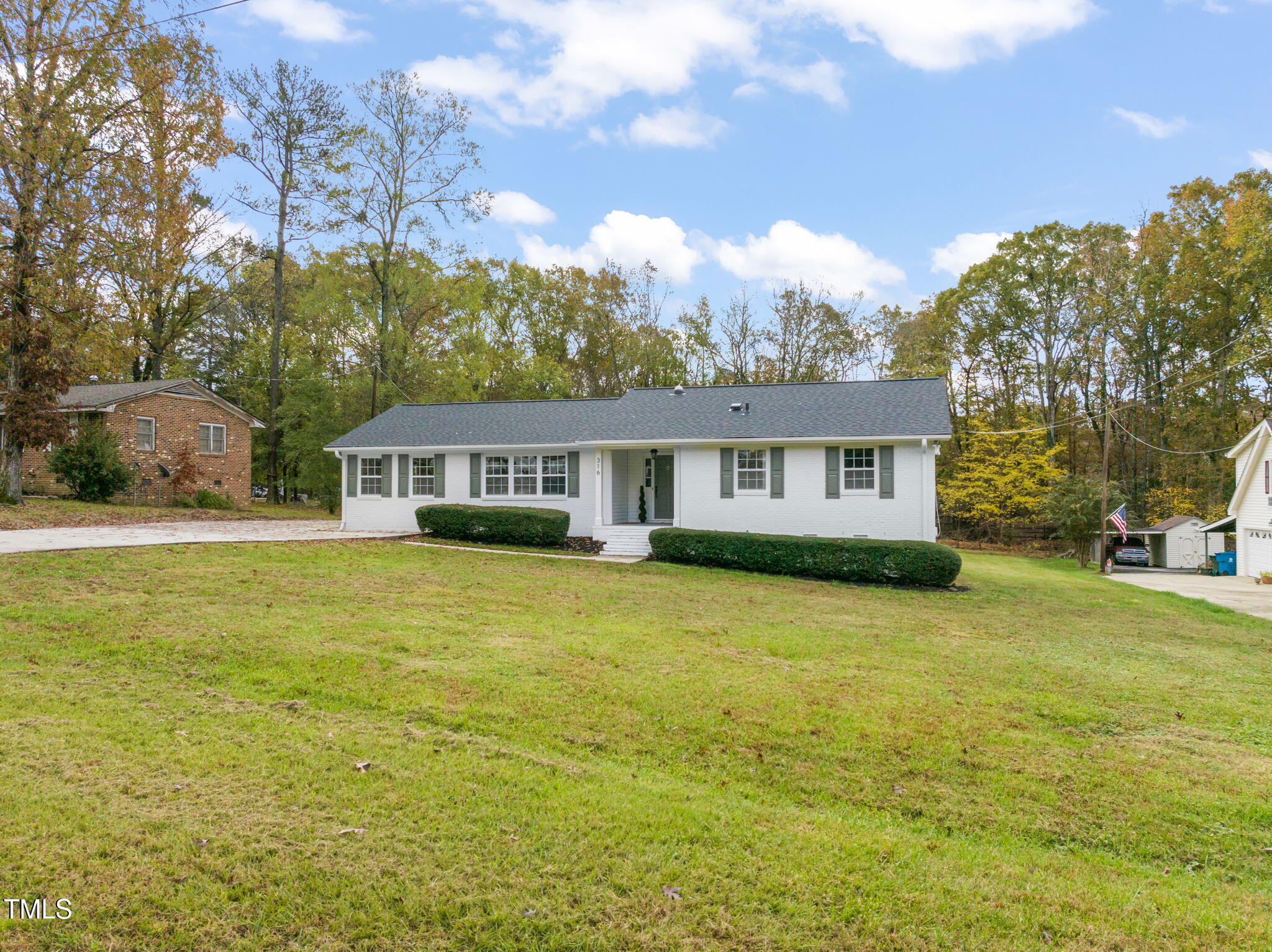 316 Ebon Road Durham, NC 27713 - Photo 32 of 48 a front view of a house with a garden