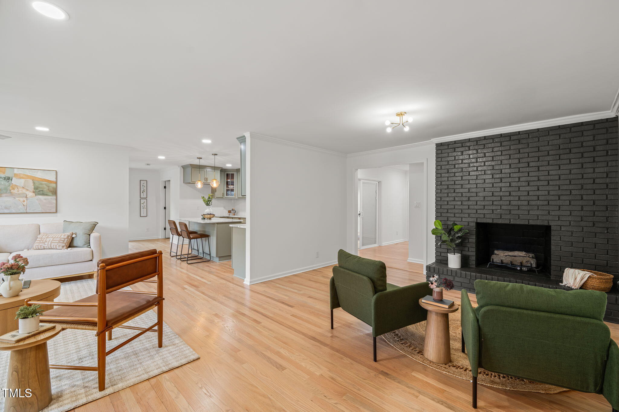 316 Ebon Road Durham, NC 27713 - Photo 40 of 48 a living room with furniture a fireplace and a wooden floor