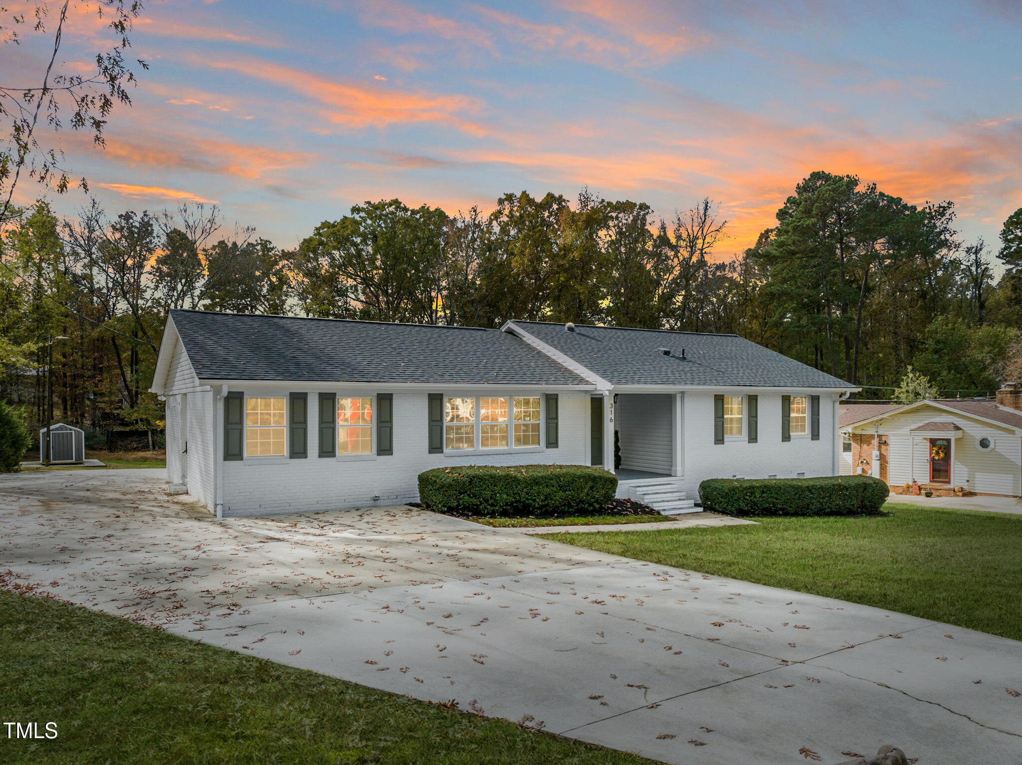 316 Ebon Road Durham, NC 27713 - Photo 5 of 48 a front view of a house with a garden
