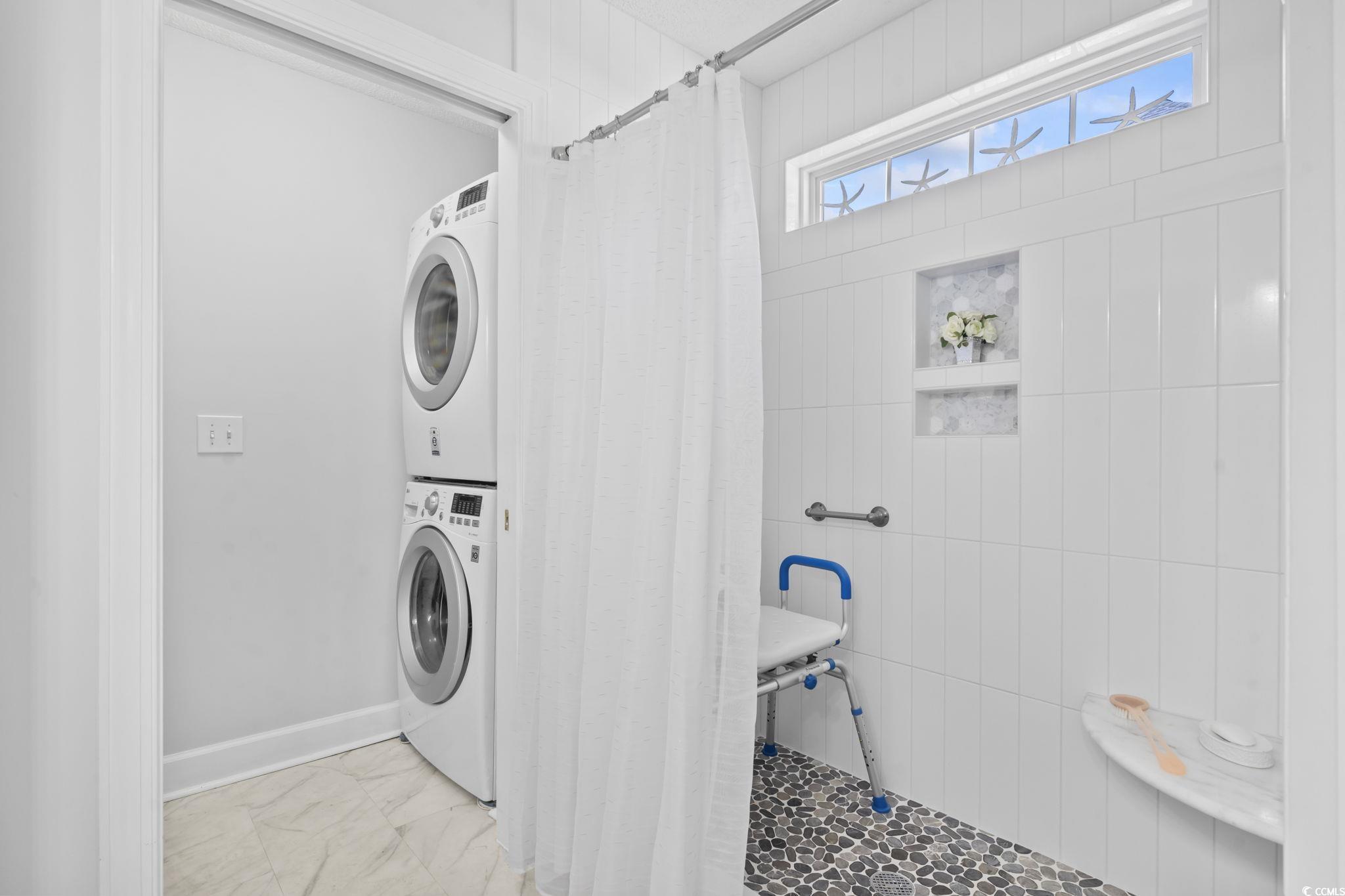 3607 Brampton Drive Myrtle Beach, SC 29588 - Photo 18 of 34 Washroom with stacked washing machine and dryer and light marble finish floors