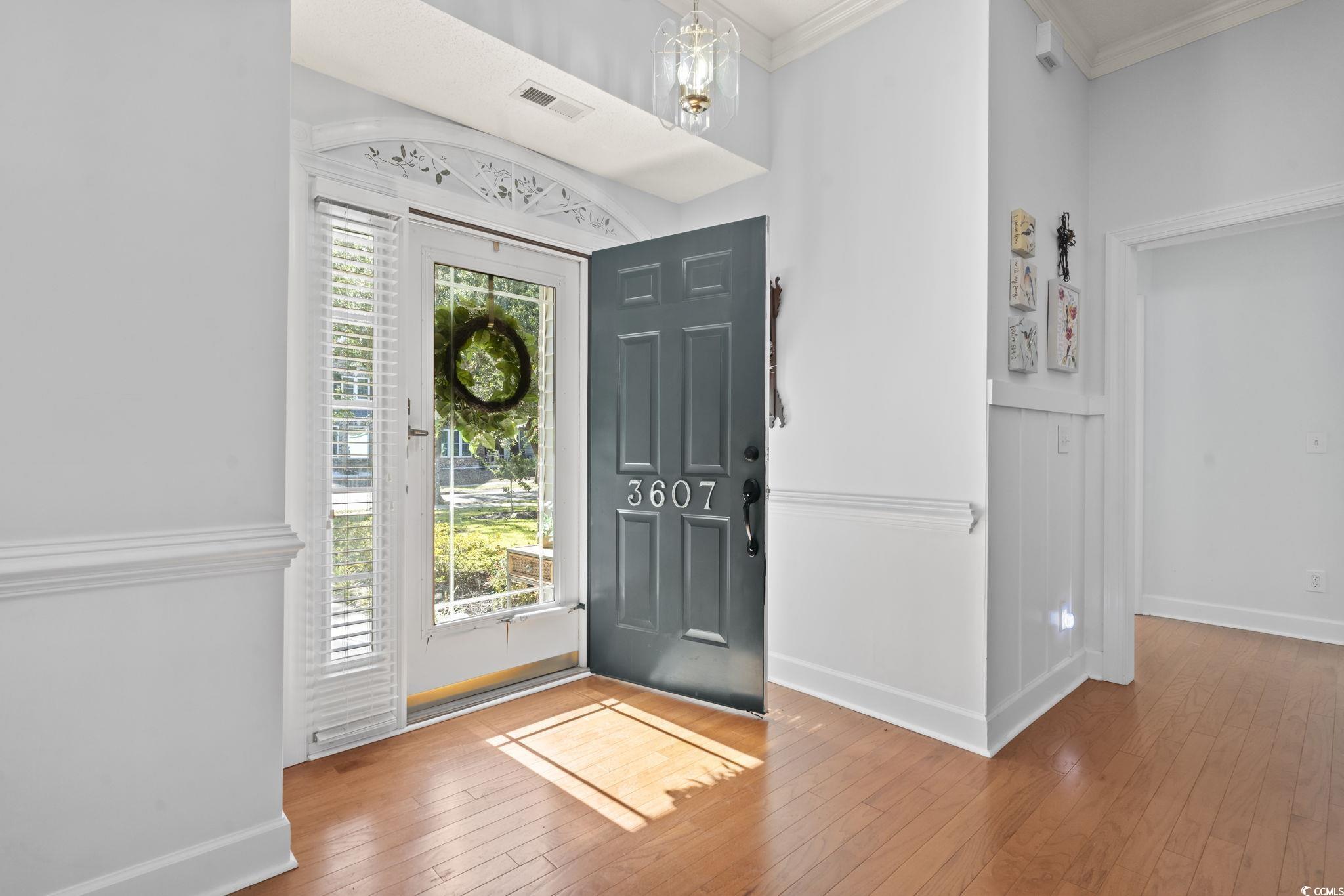 3607 Brampton Drive Myrtle Beach, SC 29588 - Photo 2 of 34 Foyer entrance with ornamental molding and wood-type flooring