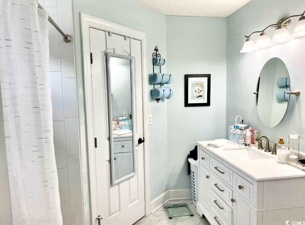 3607 Brampton Drive Myrtle Beach, SC 29588 - Photo 31 of 34 Bathroom featuring vanity and a shower with shower curtain