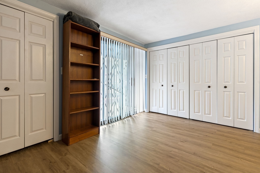 135 Forest Street, Unit W2 Saugus, MA 01906 - Photo 12 of 23 a view of empty room with wooden floor and entryway