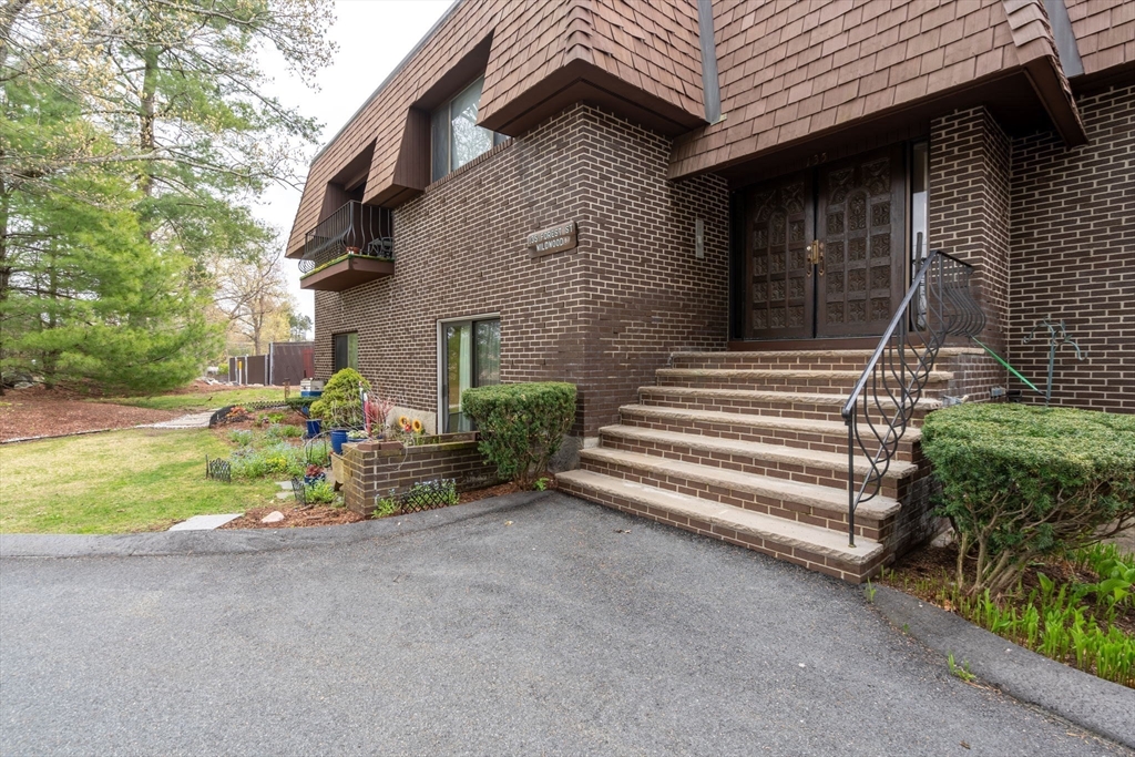 135 Forest Street, Unit W2 Saugus, MA 01906 - Photo 21 of 23 a view of backyard with a garden and entertaining space