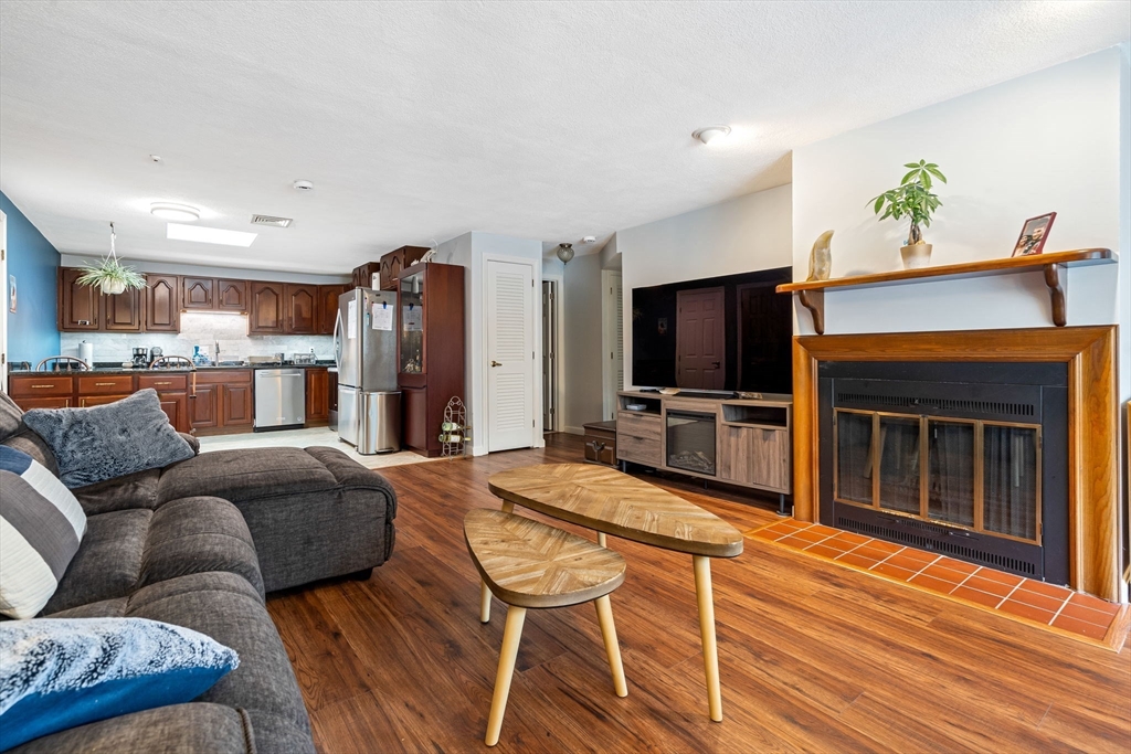 135 Forest Street, Unit W2 Saugus, MA 01906 - Photo 5 of 23 a living room with furniture and a flat screen tv