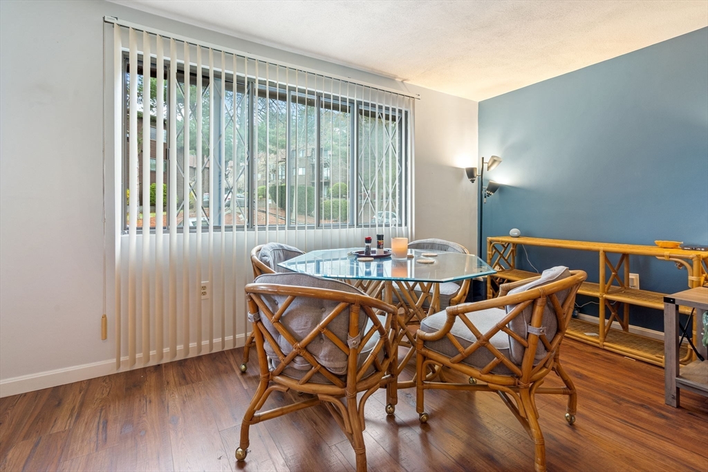 135 Forest Street, Unit W2 Saugus, MA 01906 - Photo 6 of 23 a dining room with furniture and wooden floor