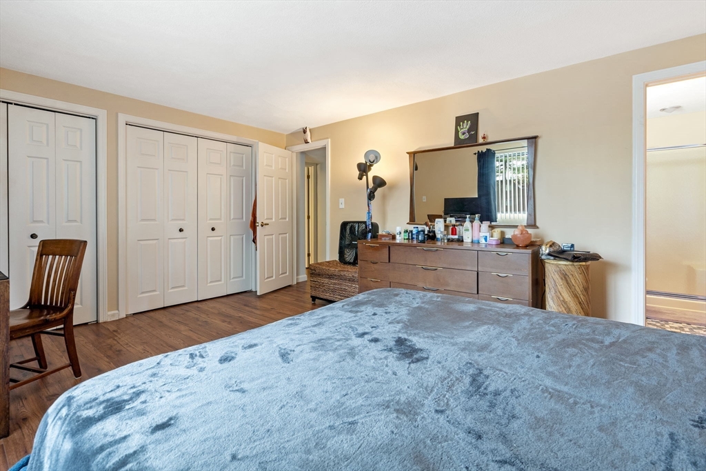 135 Forest Street, Unit W2 Saugus, MA 01906 - Photo 8 of 23 a living room with a bed furniture and a kitchen