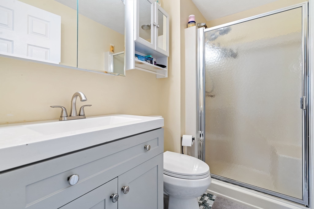 135 Forest Street, Unit W2 Saugus, MA 01906 - Photo 10 of 23 a bathroom with a sink a toilet and shower