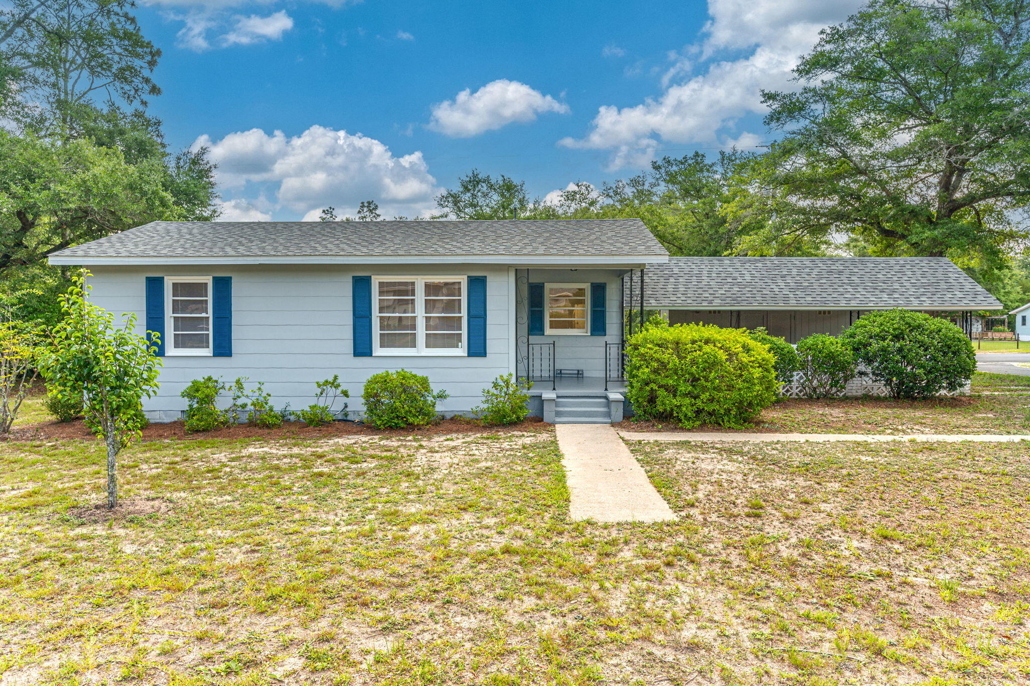 a front view of a house with garden