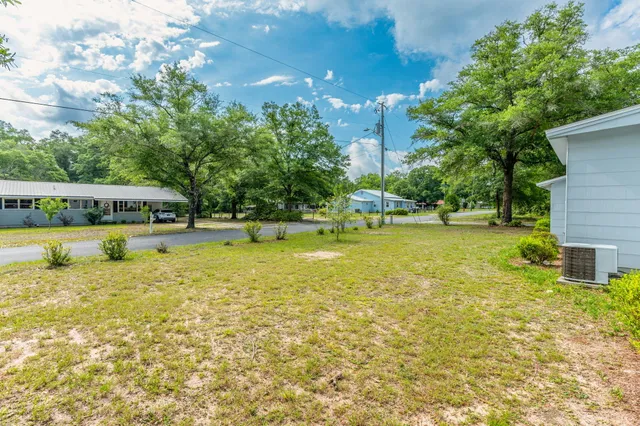 a view of a swimming pool with an outdoor space and seating area
