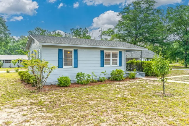 a front view of a house with a yard